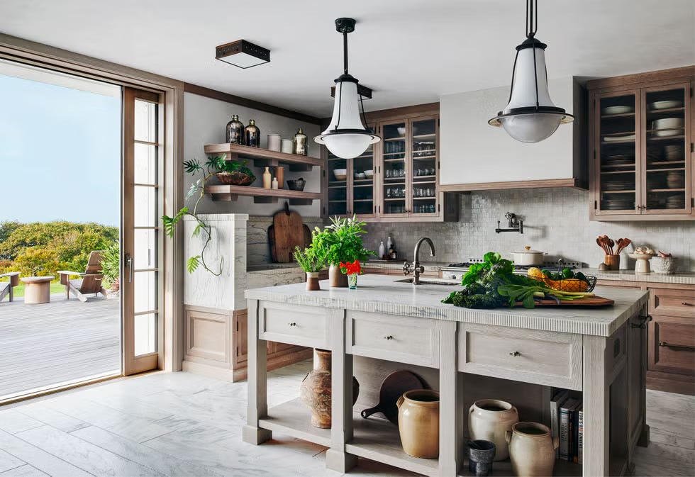 Bright kitchen with island and pendant lights